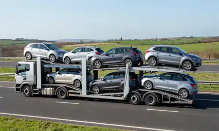 Multi-level car carrier on the motorway to Lancaster, Lancashire, United Kingdom
