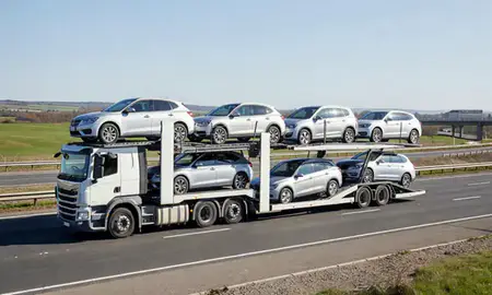 Multi-level car carrier on the motorway to Leyland, Lancashire, United Kingdom