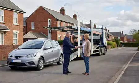 Vehicle owner beside their delivered car in Preston, Lancashire, United Kingdom