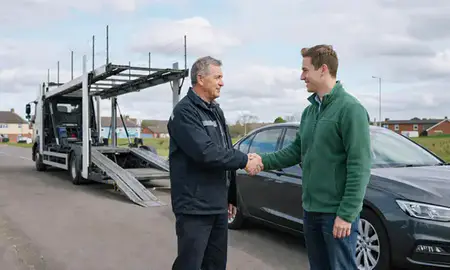 Vehicle owner beside their delivered car in Coalville, Leicestershire, United Kingdom