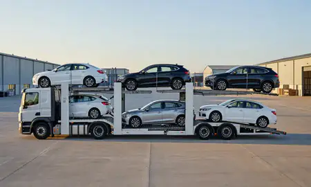 Car transporter parked in an industrial area of Coalville, Leicestershire, United Kingdom