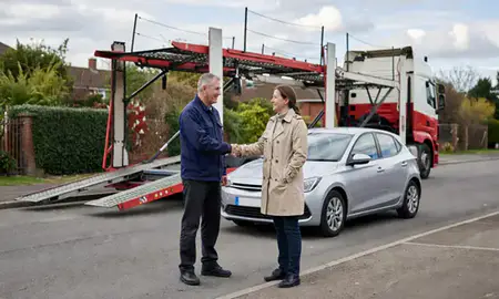 Vehicle owner beside their delivered car in Loughborough, Leicestershire, United Kingdom
