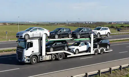 Multi-level car carrier on the motorway to Cleethorpes, Lincolnshire, United Kingdom