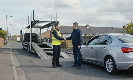 Vehicle owner beside their delivered car in Cleethorpes, Lincolnshire, United Kingdom