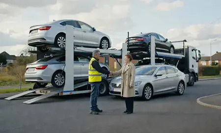 Vehicle owner beside their delivered car in Grantham, Lincolnshire, United Kingdom