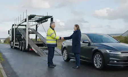 Vehicle owner beside their delivered car in Grimsby, Lincolnshire, United Kingdom