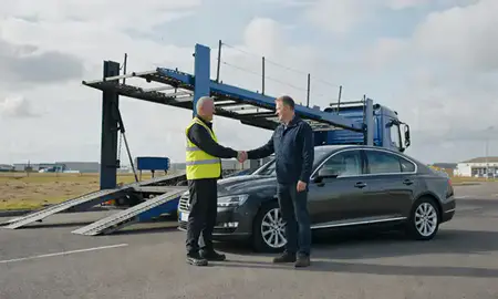 Vehicle owner beside their delivered car in Scunthorpe, Lincolnshire, United Kingdom