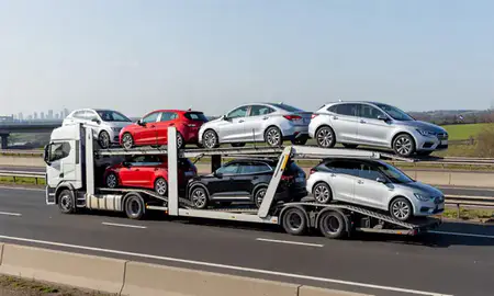 Multi-level car carrier on the motorway to London, United Kingdom