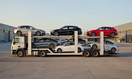 Car transporter parked in an industrial area of London, United Kingdom