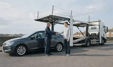 Vehicle owner beside their delivered car in Bebington, Merseyside, United Kingdom