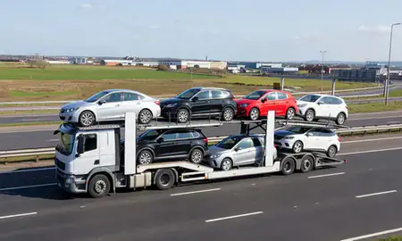 Multi-level car carrier on the motorway to Bootle, Merseyside, United Kingdom