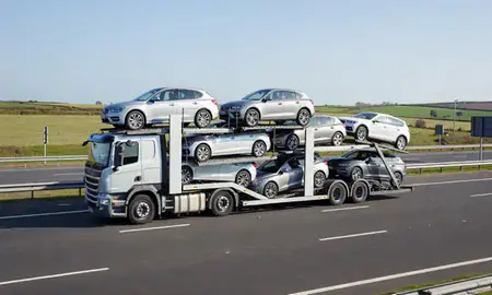 Multi-level car carrier on the motorway to Crosby, Merseyside, United Kingdom