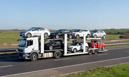 Multi-level car carrier on the motorway to Kirkby, Merseyside, United Kingdom