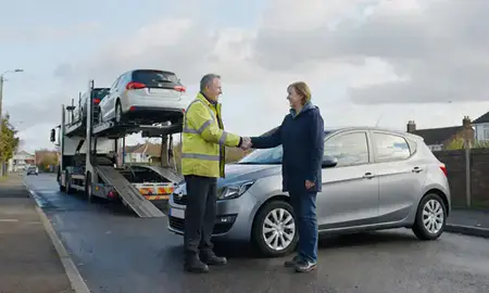 Vehicle owner beside their delivered car in Kirkby, Merseyside, United Kingdom