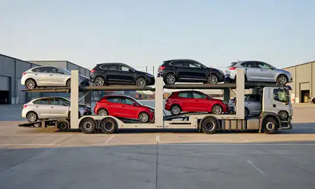 Car transporter parked in an industrial area of Kirkby, Merseyside, United Kingdom