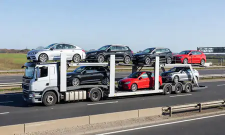 Multi-level car carrier on the motorway to Liverpool, Merseyside, United Kingdom