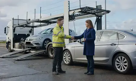 Vehicle owner beside their delivered car in Liverpool, Merseyside, United Kingdom