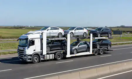 Multi-level car carrier on the motorway to Southport, Merseyside, United Kingdom