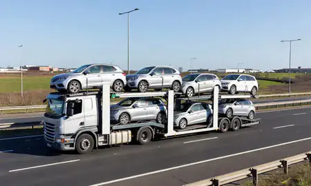 Multi-level car carrier on the motorway to Wallasey, Merseyside, United Kingdom