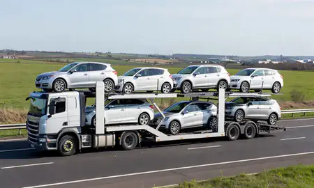 Multi-level car carrier on the motorway to Widnes, Merseyside, United Kingdom