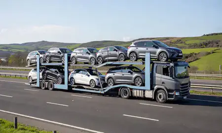 Multi-level car carrier on the motorway to Bridgend, Mid Glamorgan, United Kingdom
