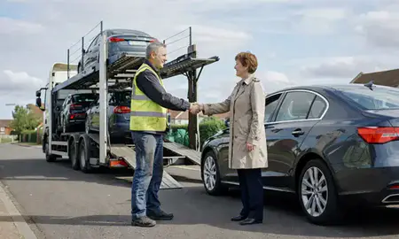 Vehicle owner beside their delivered car in Norfolk, United Kingdom