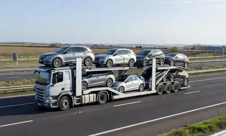 Multi-level car carrier on the motorway to King's Lynn, Norfolk, United Kingdom