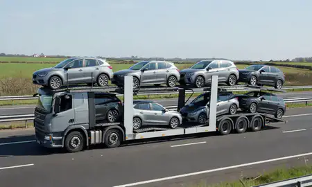 Multi-level car carrier on the motorway to Norwich, Norfolk, United Kingdom