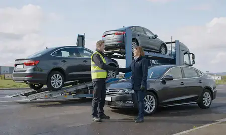 Vehicle owner beside their delivered car in North Lanarkshire, United Kingdom
