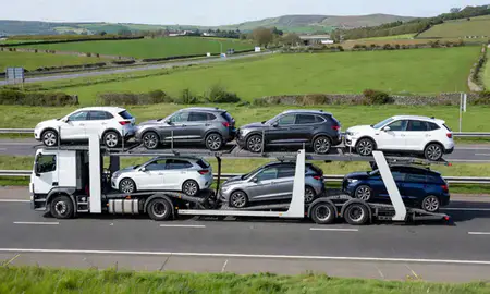 Multi-level car carrier on the motorway to Harrogate, North Yorkshire, United Kingdom