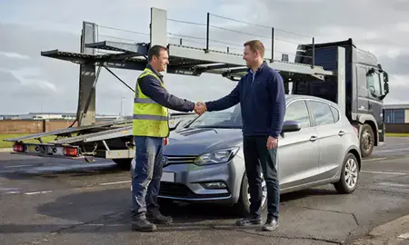 Vehicle owner beside their delivered car in Middlesbrough, North Yorkshire, United Kingdom