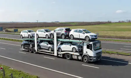 Multi-level car carrier on the motorway to Redcar, North Yorkshire, United Kingdom