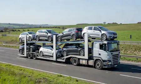 Multi-level car carrier on the motorway to York, North Yorkshire, United Kingdom