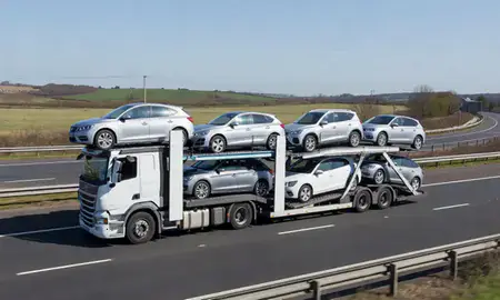 Multi-level car carrier on the motorway to Corby, Northamptonshire, United Kingdom