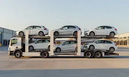Car transporter parked in an industrial area of Corby, Northamptonshire, United Kingdom