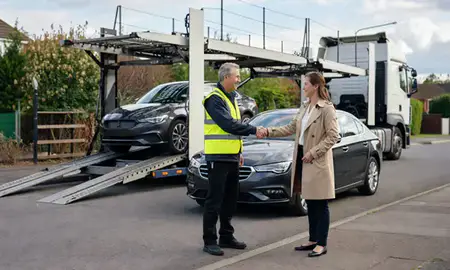 Vehicle owner beside their delivered car in Kettering, Northamptonshire, United Kingdom