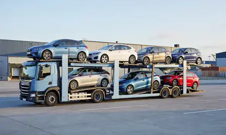 Car transporter loaded with vehicles in Kettering, Northamptonshire, United Kingdom