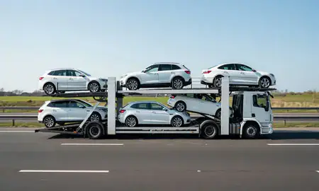 Multi-level car carrier on the motorway to Northampton, Northamptonshire, United Kingdom
