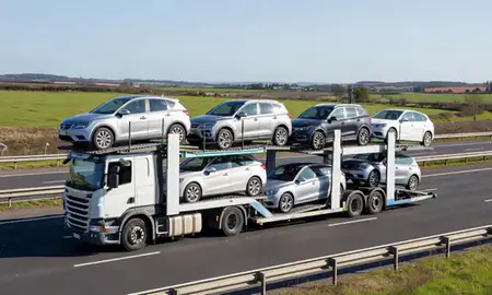 Multi-level car carrier on the motorway to Blyth, Northumberland, United Kingdom