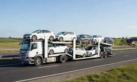 Multi-level car carrier on the motorway to Arnold, Nottinghamshire, United Kingdom