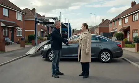 Vehicle owner beside their delivered car in Beeston, Nottinghamshire, United Kingdom