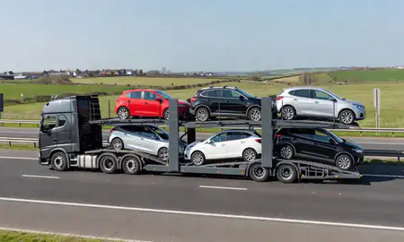 Multi-level car carrier on the motorway to Carlton, Nottinghamshire, United Kingdom