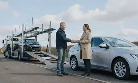 Vehicle owner beside their delivered car in Mansfield, Nottinghamshire, United Kingdom