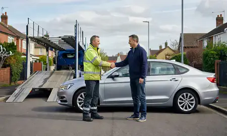 Vehicle owner beside their delivered car in Sutton-in-Ashfield, Nottinghamshire, United Kingdom