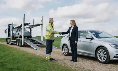 Vehicle owner beside their delivered car in Oxfordshire, United Kingdom