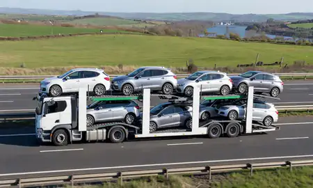 Multi-level car carrier on the motorway to Abingdon-on-Thames, Oxfordshire, United Kingdom