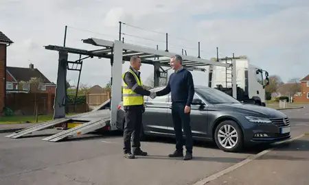 Vehicle owner beside their delivered car in Banbury, Oxfordshire, United Kingdom