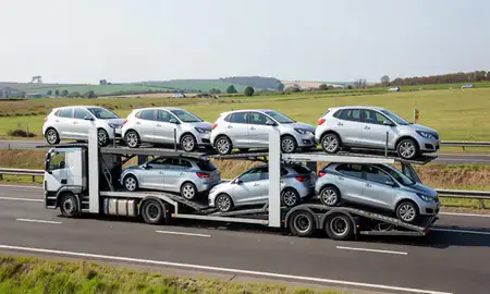 Multi-level car carrier on the motorway to Oxford, Oxfordshire, United Kingdom