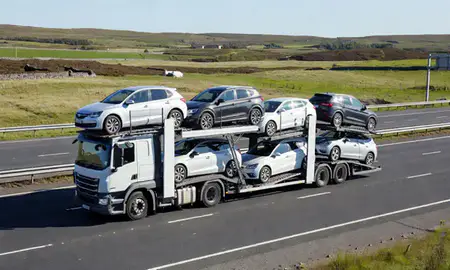 Multi-level car carrier on the motorway to Perth and Kinross, United Kingdom