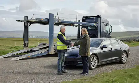 Vehicle owner beside their delivered car in Perth and Kinross, United Kingdom